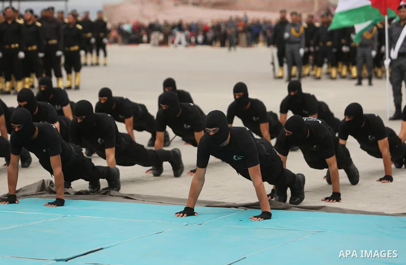 Palestinian police officers loyal to Hamas take part in a graduation ceremony in Gaza City March 30, 2017. Photo by Ashraf Amra
