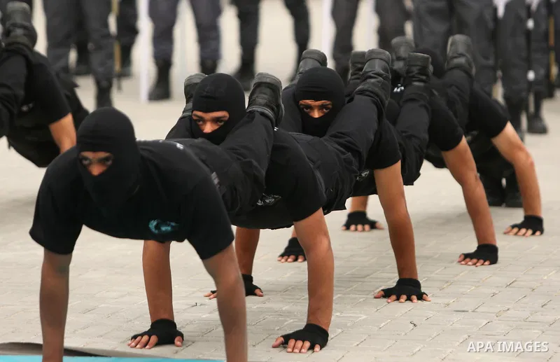 Palestinian police officers loyal to Hamas take part in a graduation ceremony in Gaza City March 30, 2017. Photo by Ashraf Amra