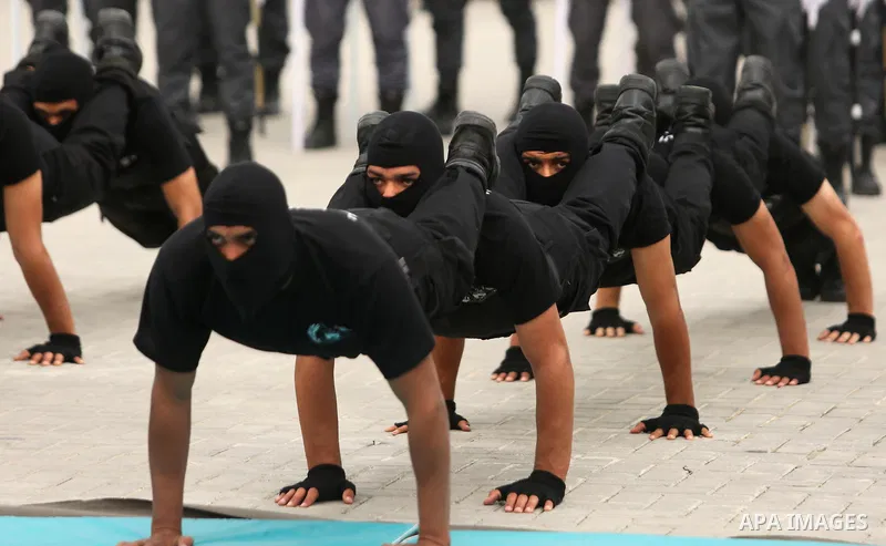Palestinian police officers loyal to Hamas take part in a graduation ceremony in Gaza City March 30, 2017. Photo by Ashraf Amra