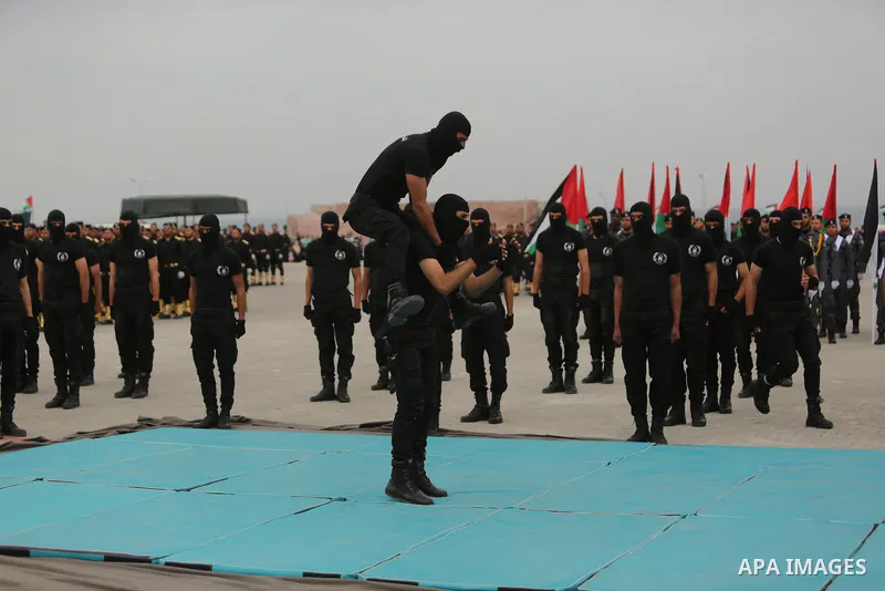 Palestinian police officers loyal to Hamas take part in a graduation ceremony in Gaza City March 30, 2017. Photo by Ashraf Amra