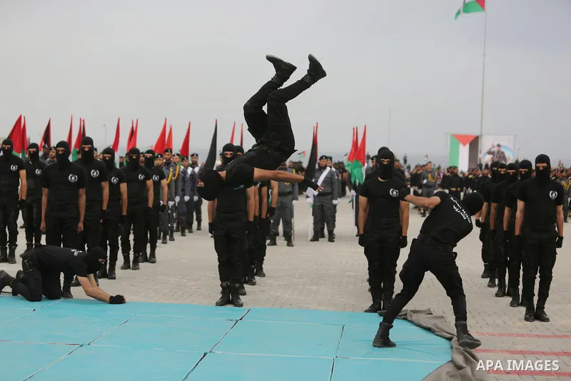 Palestinian police officers loyal to Hamas take part in a graduation ceremony in Gaza City March 30, 2017. Photo by Ashraf Amra