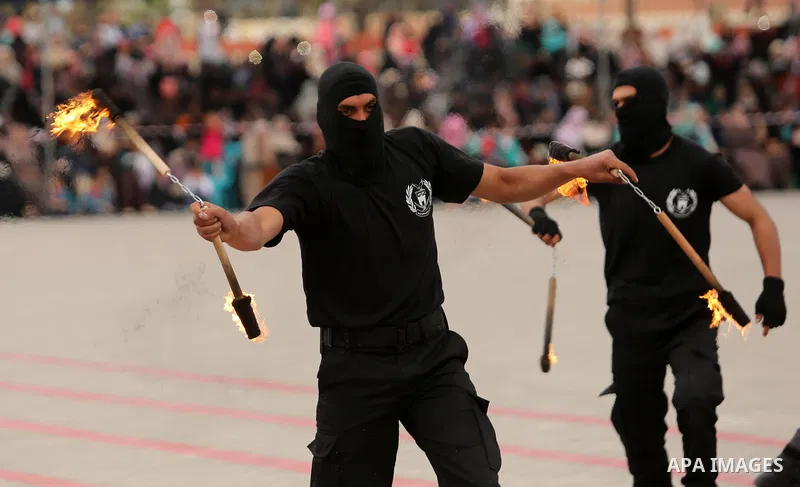 Palestinian police officers loyal to Hamas take part in a graduation ceremony in Gaza City March 30, 2017. Photo by Ashraf Amra