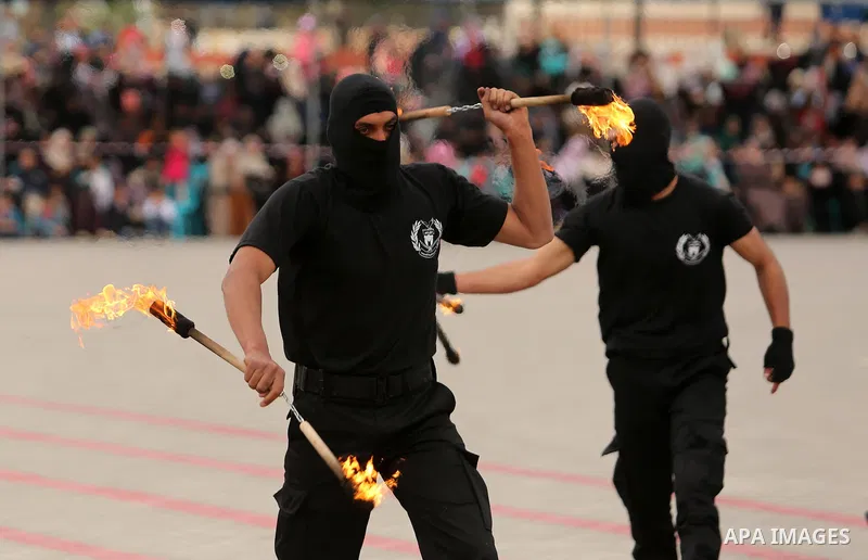 Palestinian police officers loyal to Hamas take part in a graduation ceremony in Gaza City March 30, 2017. Photo by Ashraf Amra