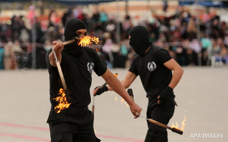 Palestinian police officers loyal to Hamas take part in a graduation ceremony in Gaza City March 30, 2017. Photo by Ashraf Amra