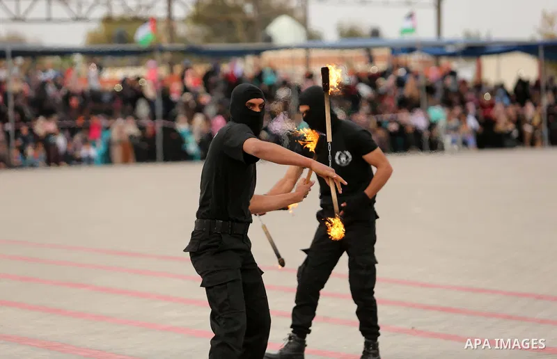 Palestinian police officers loyal to Hamas take part in a graduation ceremony in Gaza City March 30, 2017. Photo by Ashraf Amra