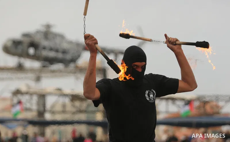 Palestinian police officers loyal to Hamas take part in a graduation ceremony in Gaza City March 30, 2017. Photo by Ashraf Amra