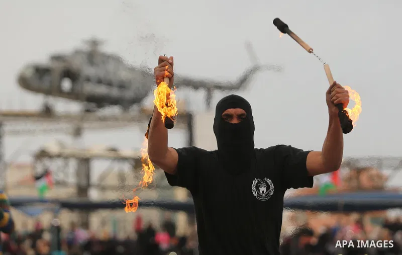 Palestinian police officers loyal to Hamas take part in a graduation ceremony in Gaza City March 30, 2017. Photo by Ashraf Amra
