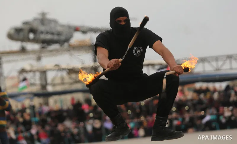 Palestinian police officers loyal to Hamas take part in a graduation ceremony in Gaza City March 30, 2017. Photo by Ashraf Amra