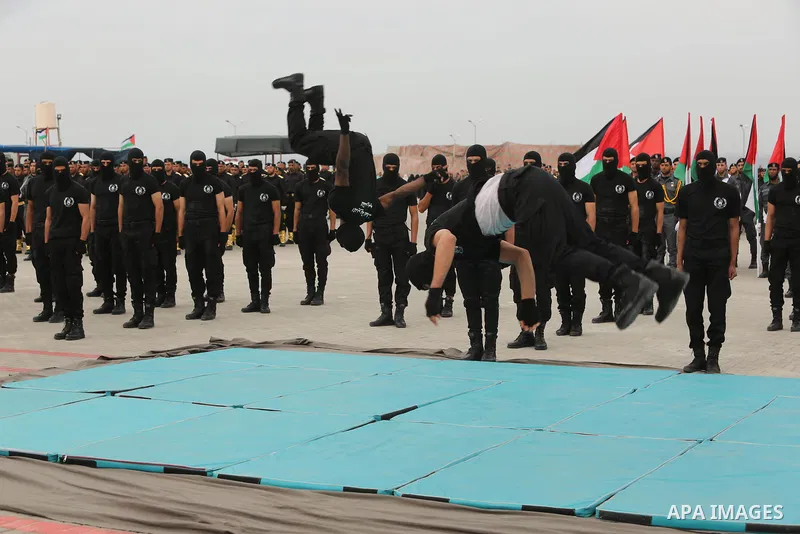 Palestinian police officers loyal to Hamas take part in a graduation ceremony in Gaza City March 30, 2017. Photo by Ashraf Amra