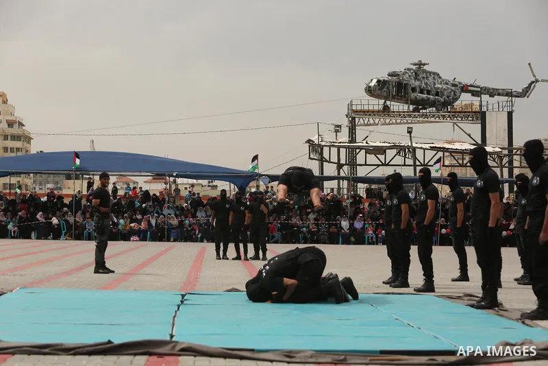 Palestinian police officers loyal to Hamas take part in a graduation ceremony in Gaza City March 30, 2017. Photo by Ashraf Amra