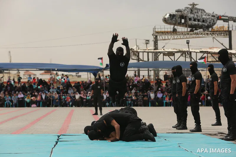 Palestinian police officers loyal to Hamas take part in a graduation ceremony in Gaza City March 30, 2017. Photo by Ashraf Amra