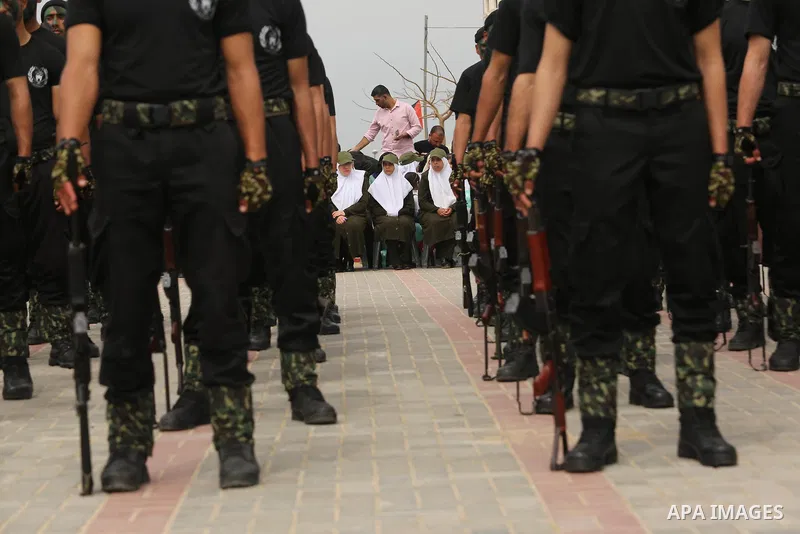 Palestinian police officers loyal to Hamas take part in a graduation ceremony in Gaza City March 30, 2017. Photo by Ashraf Amra