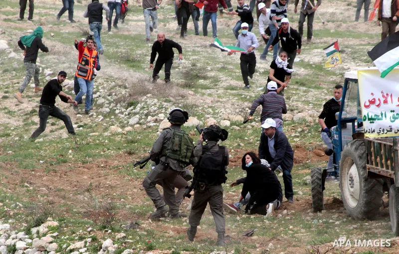 Palestinian demonstrators clash with Israel forces following a protest to mark land day in village of Madama, south of Nablus, on March 30, 2017 in the Israeli occupied West Bank. Land Day marks the killing of six Arab I...