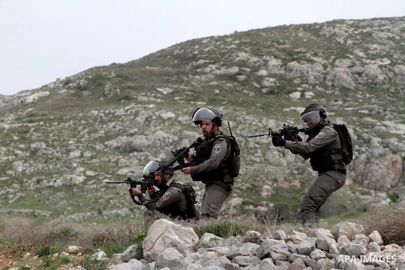 Israel forces take position during clashes with Palestinian demonstrators following a protest to mark land day in village of Madama, south of Nablus, on March 30, 2017 in the Israeli occupied West Bank. Land Day marks th...