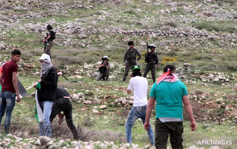 Palestinian demonstrators clash with Israel forces following a protest to mark land day in village of Madama, south of Nablus, on March 30, 2017 in the Israeli occupied West Bank. Land Day marks the killing of six Arab I...