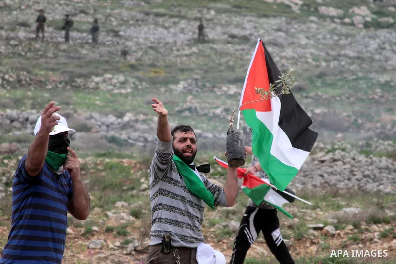 Palestinian demonstrators clash with Israel forces following a protest to mark land day in village of Madama, south of Nablus, on March 30, 2017 in the Israeli occupied West Bank. Land Day marks the killing of six Arab I...