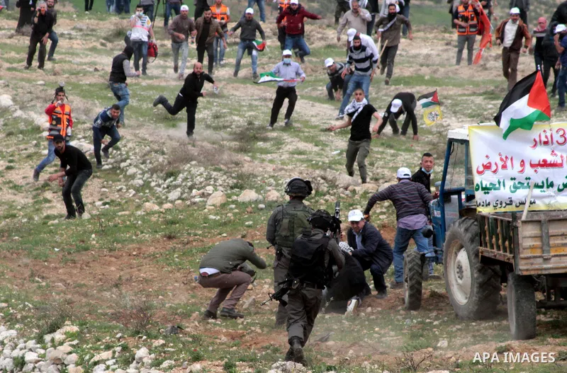 Palestinian demonstrators clash with Israel forces following a protest to mark land day in village of Madama, south of Nablus, on March 30, 2017 in the Israeli occupied West Bank. Land Day marks the killing of six Arab I...