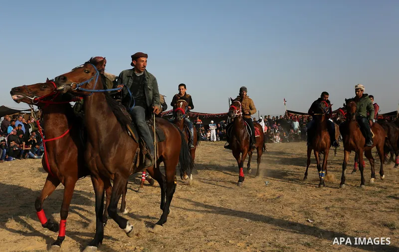 Palestinian Bedouins ride horses during a rally marking the 41st anniversary of Land Day, in Deir el-Balah, Central Gaza Strip, on March 31, 2017. Land Day marks the killing of six Arab Israelis during 1976 demonstration...