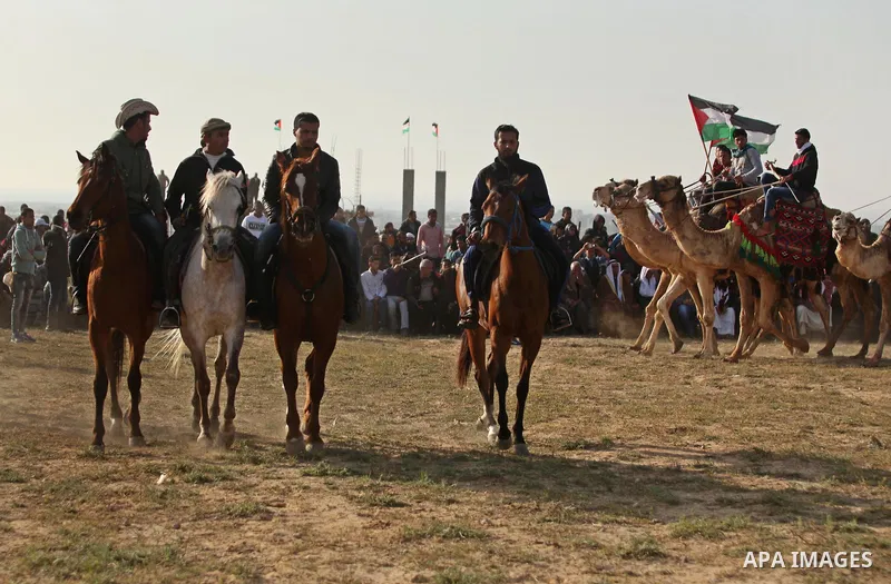Palestinian Bedouins ride horses during a rally marking the 41st anniversary of Land Day, in Deir el-Balah, Central Gaza Strip, on March 31, 2017. Land Day marks the killing of six Arab Israelis during 1976 demonstration...