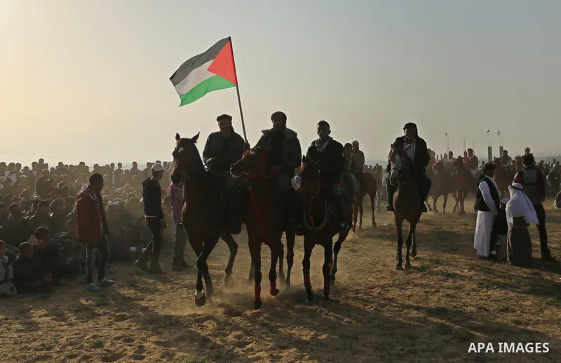 Palestinian Bedouins ride horses during a rally marking the 41st anniversary of Land Day, in Deir el-Balah, Central Gaza Strip, on March 31, 2017. Land Day marks the killing of six Arab Israelis during 1976 demonstration...