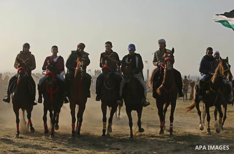 Palestinian Bedouins ride horses during a rally marking the 41st anniversary of Land Day, in Deir el-Balah, Central Gaza Strip, on March 31, 2017. Land Day marks the killing of six Arab Israelis during 1976 demonstration...