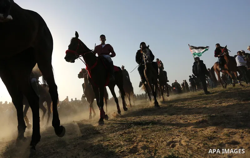 Palestinian Bedouins ride horses during a rally marking the 41st anniversary of Land Day, in Deir el-Balah, Central Gaza Strip, on March 31, 2017. Land Day marks the killing of six Arab Israelis during 1976 demonstration...