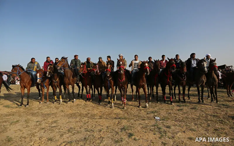 Palestinian Bedouins ride horses during a rally marking the 41st anniversary of Land Day, in Deir el-Balah, Central Gaza Strip, on March 31, 2017. Land Day marks the killing of six Arab Israelis during 1976 demonstration...
