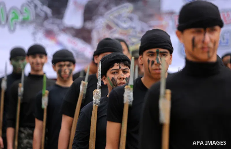 Palestinian high-school students show off their skills during a graduation ceremony from a military school course organised by the Palestinian security forces in Gaza strip, in Gaza City, on April 2, 2017. Photo by Ashra...