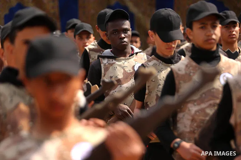 Palestinian high-school students show off their skills during a graduation ceremony from a military school course organised by the Palestinian security forces in Gaza strip, in Gaza City, on April 2, 2017. Photo by Ashra...