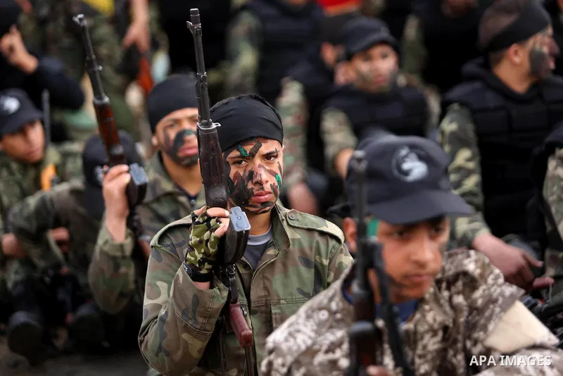 Palestinian high-school students show off their skills during a graduation ceremony from a military school course organised by the Palestinian security forces in Gaza strip, in Gaza City, on April 2, 2017. Photo by Ashra...