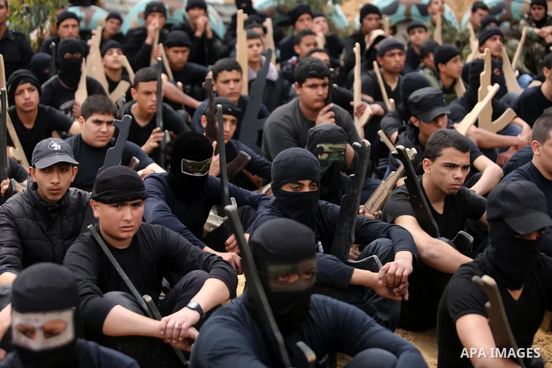 Palestinian high-school students show off their skills during a graduation ceremony from a military school course organised by the Palestinian security forces in Gaza strip, in Gaza City, on April 2, 2017. Photo by Ashra...