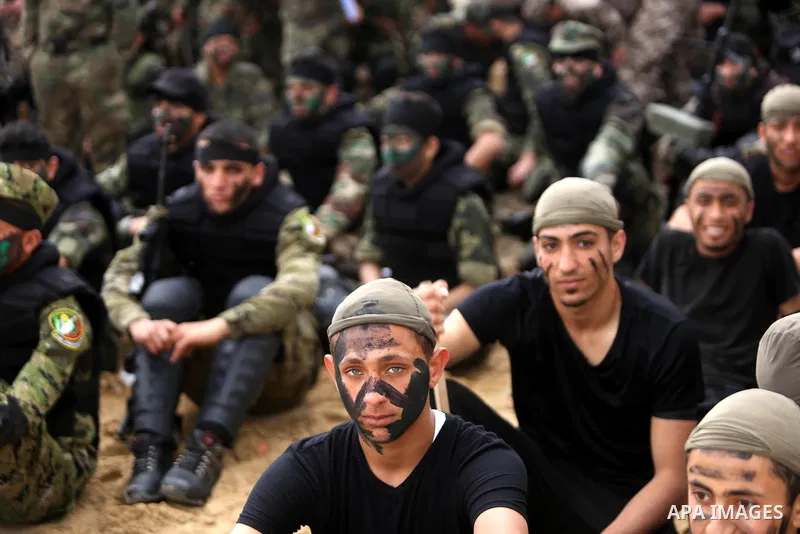 Palestinian high-school students show off their skills during a graduation ceremony from a military school course organised by the Palestinian security forces in Gaza strip, in Gaza City, on April 2, 2017. Photo by Ashra...