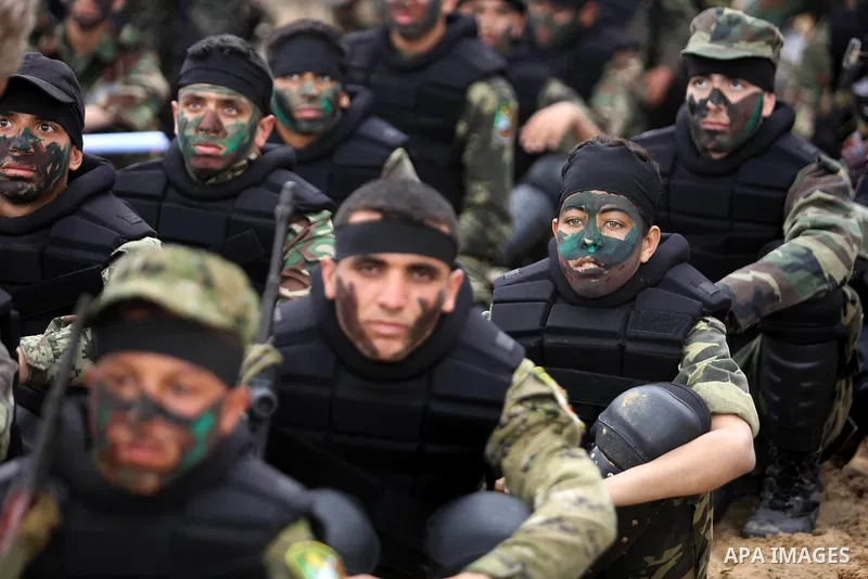 Palestinian high-school students show off their skills during a graduation ceremony from a military school course organised by the Palestinian security forces in Gaza strip, in Gaza City, on April 2, 2017. Photo by Ashra...