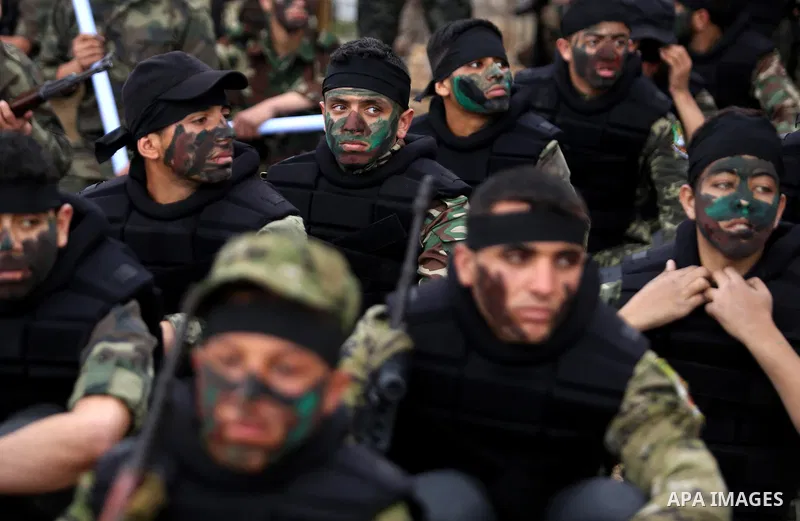 Palestinian high-school students show off their skills during a graduation ceremony from a military school course organised by the Palestinian security forces in Gaza strip, in Gaza City, on April 2, 2017. Photo by Ashra...