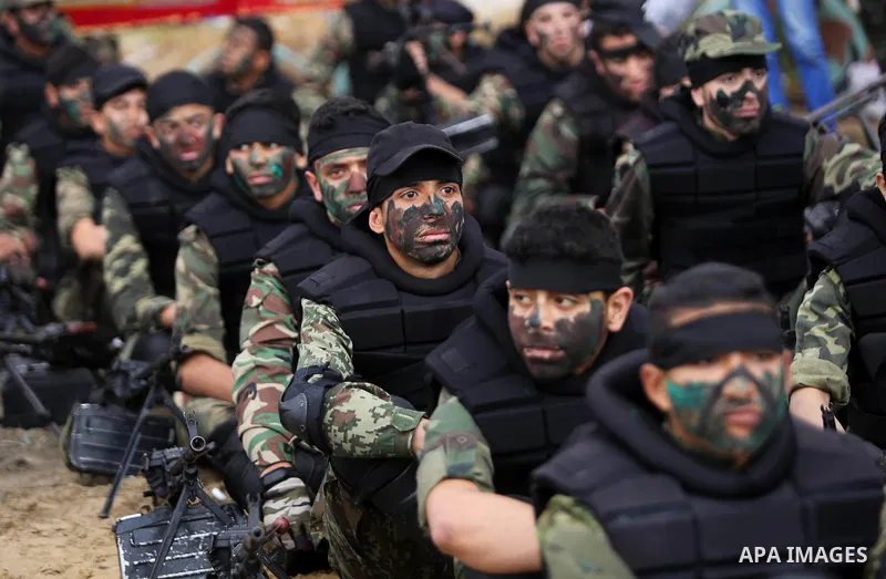 Palestinian high-school students show off their skills during a graduation ceremony from a military school course organised by the Palestinian security forces in Gaza strip, in Gaza City, on April 2, 2017. Photo by Ashra...
