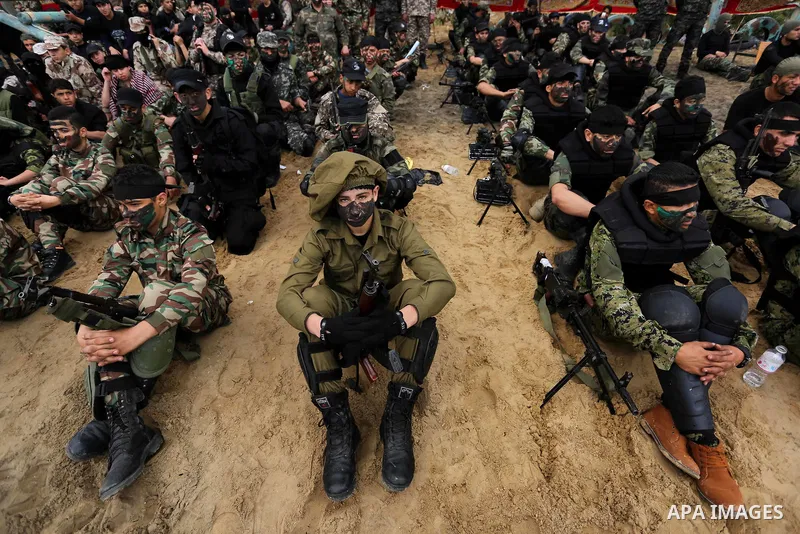 Palestinian high-school students show off their skills during a graduation ceremony from a military school course organised by the Palestinian security forces in Gaza strip, in Gaza City, on April 2, 2017. Photo by Ashra...