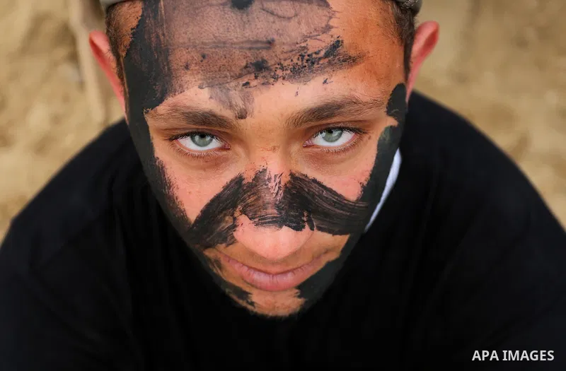 Palestinian high-school students show off their skills during a graduation ceremony from a military school course organised by the Palestinian security forces in Gaza strip, in Gaza City, on April 2, 2017. Photo by Ashra...