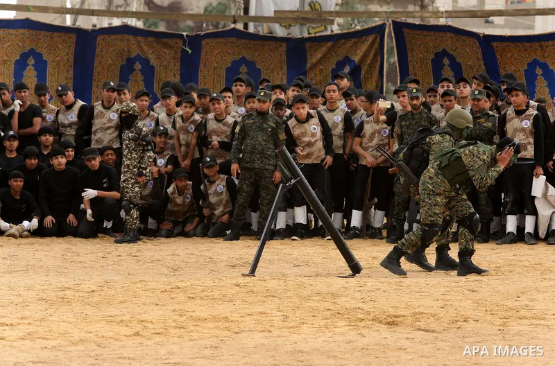 Palestinian high-school students show off their skills during a graduation ceremony from a military school course organised by the Palestinian security forces in Gaza strip, in Gaza City, on April 2, 2017. Photo by Ashra...