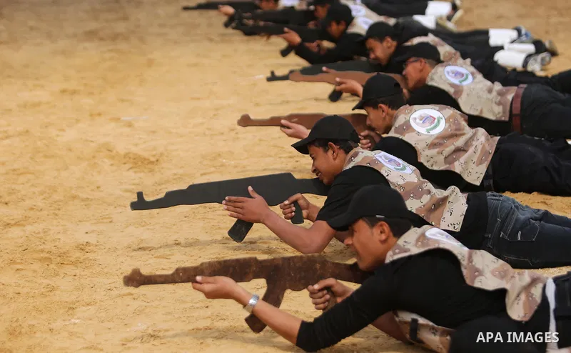 Palestinian high-school students show off their skills during a graduation ceremony from a military school course organised by the Palestinian security forces in Gaza strip, in Gaza City, on April 2, 2017. Photo by Ashra...