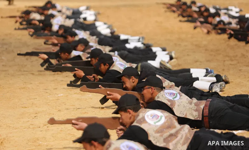 Palestinian high-school students show off their skills during a graduation ceremony from a military school course organised by the Palestinian security forces in Gaza strip, in Gaza City, on April 2, 2017. Photo by Ashra...