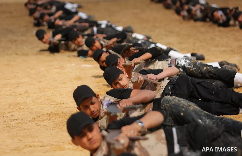 Palestinian high-school students show off their skills during a graduation ceremony from a military school course organised by the Palestinian security forces in Gaza strip, in Gaza City, on April 2, 2017. Photo by Ashra...
