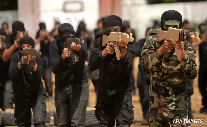 Palestinian high-school students show off their skills during a graduation ceremony from a military school course organised by the Palestinian security forces in Gaza strip, in Gaza City, on April 2, 2017. Photo by Ashra...