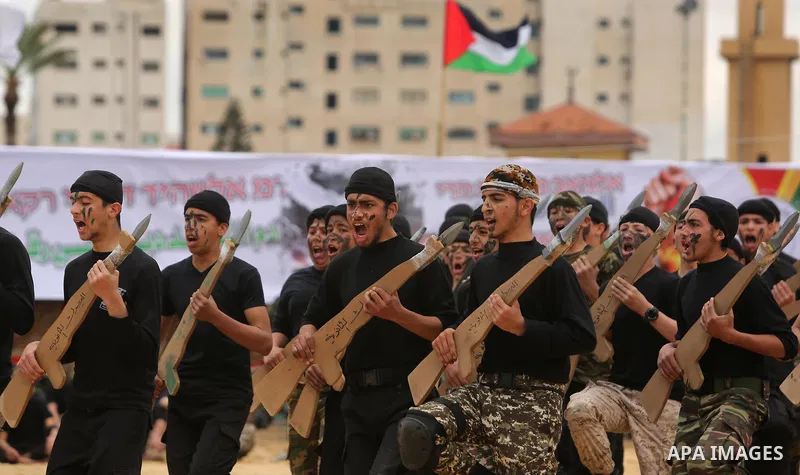 Palestinian high-school students show off their skills during a graduation ceremony from a military school course organised by the Palestinian security forces in Gaza strip, in Gaza City, on April 2, 2017. Photo by Ashra...