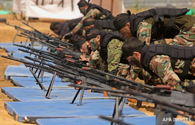 Palestinian high-school students show off their skills during a graduation ceremony from a military school course organised by the Palestinian security forces in Gaza strip, in Gaza City, on April 2, 2017. Photo by Ashra...