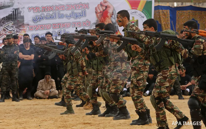 Palestinian high-school students show off their skills during a graduation ceremony from a military school course organised by the Palestinian security forces in Gaza strip, in Gaza City, on April 2, 2017. Photo by Ashra...