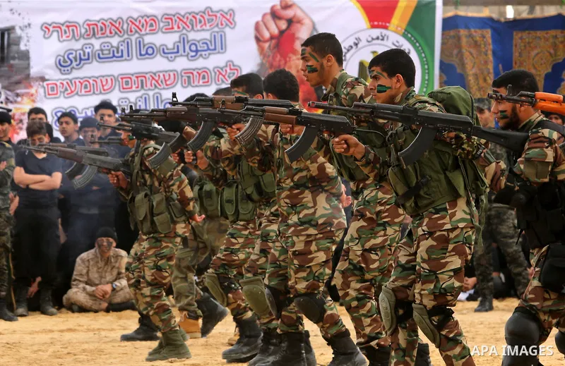 Palestinian high-school students show off their skills during a graduation ceremony from a military school course organised by the Palestinian security forces in Gaza strip, in Gaza City, on April 2, 2017. Photo by Ashra...