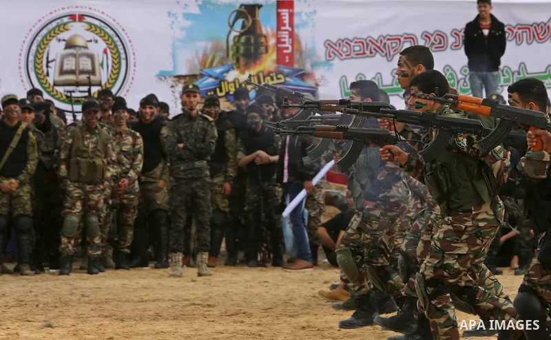 Palestinian high-school students show off their skills during a graduation ceremony from a military school course organised by the Palestinian security forces in Gaza strip, in Gaza City, on April 2, 2017. Photo by Ashra...