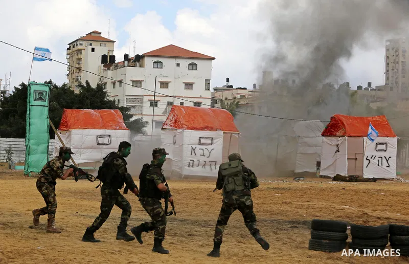 Palestinian high-school students show off their skills during a graduation ceremony from a military school course organised by the Palestinian security forces in Gaza strip, in Gaza City, on April 2, 2017. Photo by Ashra...
