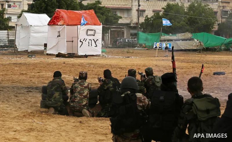 Palestinian high-school students show off their skills during a graduation ceremony from a military school course organised by the Palestinian security forces in Gaza strip, in Gaza City, on April 2, 2017. Photo by Ashra...