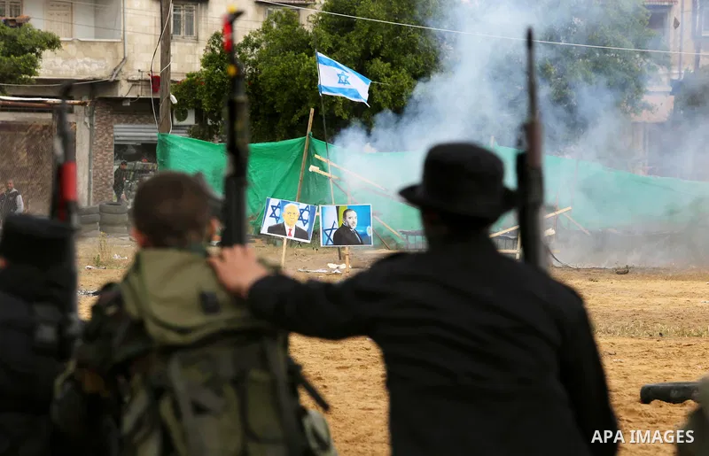 Palestinian high-school students show off their skills during a graduation ceremony from a military school course organised by the Palestinian security forces in Gaza strip, in Gaza City, on April 2, 2017. Photo by Ashra...